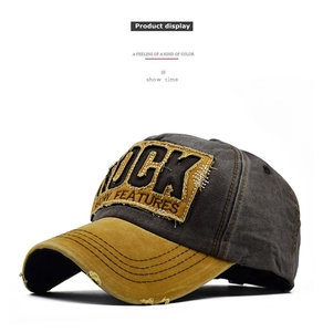Detailed macro view of heavy canvas vintage distressed baseball cap with ROCK embroidery