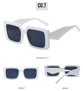 Detail showing the wide temple design and sturdy frame of white square sunglasses