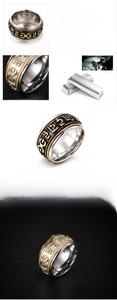 Macro shot of 10mm rotatable stainless steel ring with 18K gold plating and relief pattern