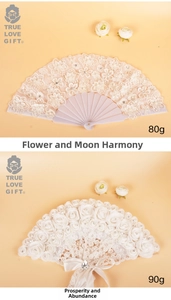 Detail of luxury lace folding fans with 3D roses, elegant pearls and silk ribbon bow