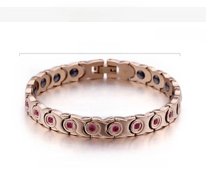 Detail of rose gold stainless steel magnetic bracelet with red zircon and measurements