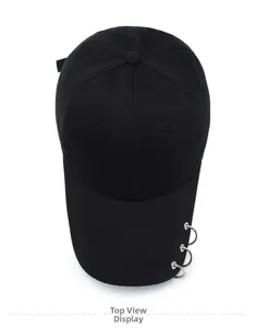 Top view of a black wool baseball cap featuring three silver metal ring decorations