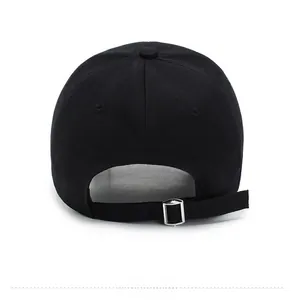 Detail view of the black wool baseball cap featuring an adjustable silver metal buckle