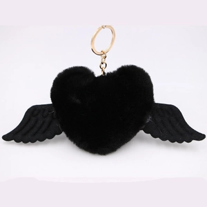 Close-up of black plush heart keychain with wings and gold-tone alloy spring ring hook