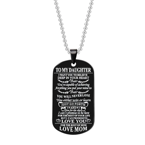 Detailed engraving on black dog tag necklace with emotional text from Mom to Daughter