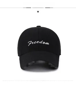 Close-up of the Freedom embroidery on a thick black wool winter baseball cap
