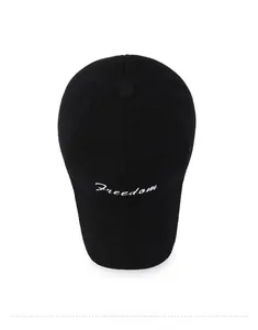 Top-down view of black cotton baseball cap with white Freedom embroidery on crown
