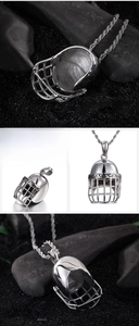 Detailed macro view of a silver rugby helmet pendant crafted in durable stainless steel