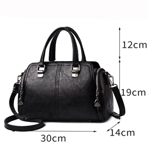 Black leather handbag for women with top handles and dimensions 30x14x19cm on white background