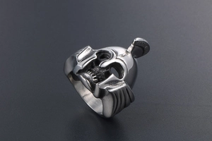 Detailed view of vintage silver Spartan helmet ring with skull design in steel finish