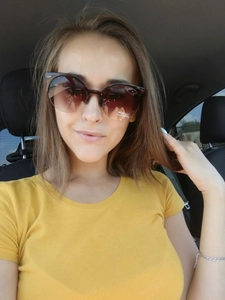 Retro cat-eye sunglasses with dark gradient lenses and UV400 protection on model