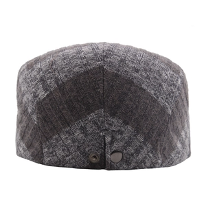 Unisex dark grey knit flat cap with ribbed texture and metal button detail back view