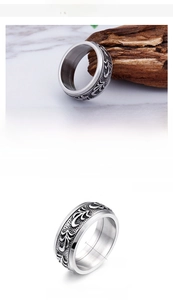 Detailed macro view of 9mm stainless steel ring with vintage floral engraving