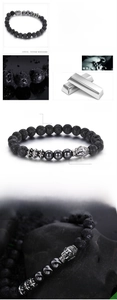 Macro detail of 8mm volcanic lava rock and hematite beads with steel Buddha head