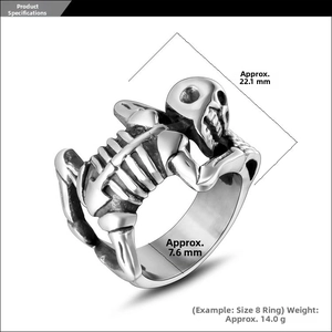 Macro detail of punk skull ring showing 3D carved textures and gothic silver finish