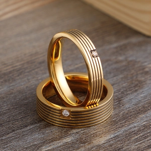 Gold titanium steel couple rings with striped texture and square-set zircon stones