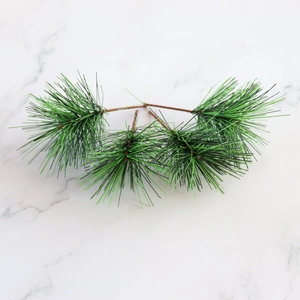 Close-up of artificial four-fork pine needles in dark green for DIY Christmas decor