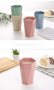 Detail of eco-friendly wheat straw cup with hexagonal geometric design and natural texture