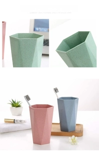 Close-up of smooth rim and matte hexagonal texture on durable plastic toothbrush cups