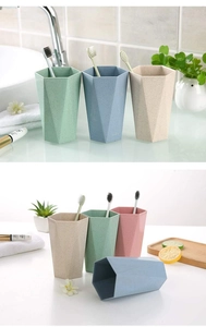 Detail showing geometric hexagonal wheat straw toothbrush cups in multiple pastel colors