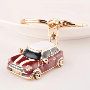 Miniature beetle car keychain in wine red with white roof and rhinestone accents