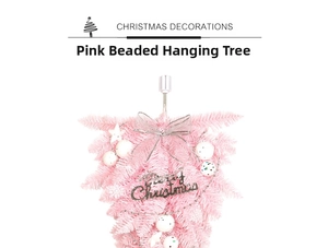 Detail of pink upside-down Christmas tree with silver bows and Merry Christmas sign
