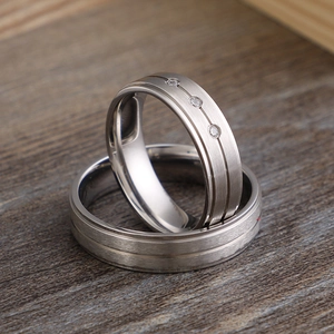 Titanium steel frosted couple rings with brushed metal texture and zircon stones