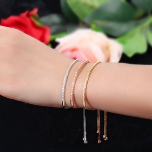 Detailed view of adjustable micro-set zircon bracelets in gold, silver, and rose gold finishes