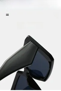 Detail of premium black square sunglasses featuring a durable hinge and flexible temples
