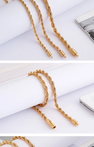 Close-up of golden rope chain necklace showing intricate twist texture and lobster clasp