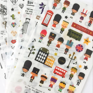 Detail showing watercolor travel stickers with London landmarks for DIY diary