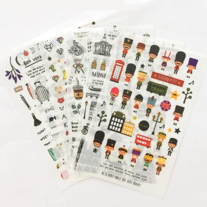 Detailed view of watercolor travel stickers featuring London soldiers and floral motifs