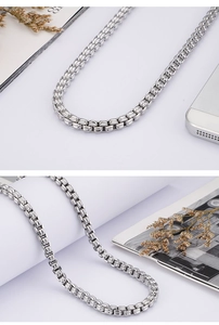 Detailed close-up of 6mm stainless steel silver box chain necklace with metallic luster
