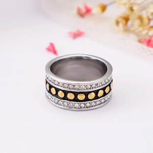 Street style silver ring with black band, gold studs and clear zircon stones decoration