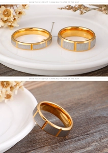Detail view of two-tone stainless steel rings with gold plating and brushed silver finish