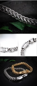 Detail of woven stainless steel chain bracelets in silver and gold finishes