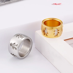 Titanium steel ring with hollow boy and girl motifs inlaid with zircon in gold and silver