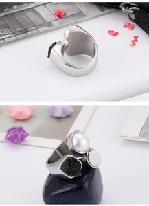 Detail showing the polished silver ring featuring three pearls and glitter textures
