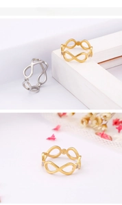 Close-up of infinity ring in gold and silver finish with crystal micro-inlay