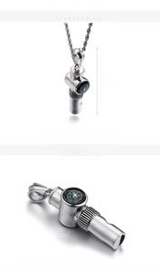 Detail of stainless steel whistle pendant with compass showing 47x19mm size and 26g weight