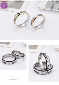 Detail of couple rings with Forever Love engraving and cubic zirconia inlays