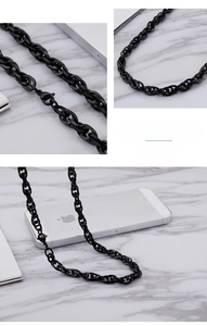 Detail of black stainless steel oval link chain necklace with secure lobster clasp