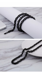 Detail of black double link chain showing durable stainless steel texture and finish