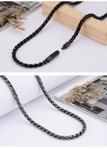 Detail of dark grey metal woven chain necklace with secure lobster clasp and stylish texture
