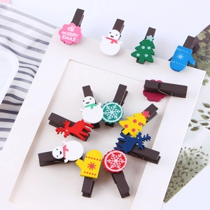 Colorful Christmas wooden clips with snowman and reindeer shapes for photo decoration