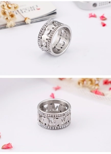 Close-up of double-row pavé diamonds and hollow elephant pattern on silver steel ring