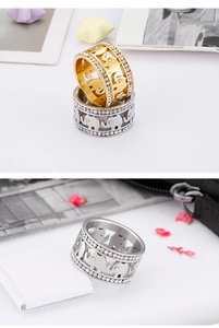 Detail of hollow elephant ring with double row of rhinestones in gold and silver finish
