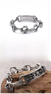 Detail of 316L stainless steel skull bracelet clasp with engraved material logo