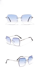 Three-way view of rimless sunglasses with blue gradient lenses and golden metal temples