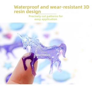 Detailed view of 3D purple unicorn resin sticker with gold glitter and Monoceros text